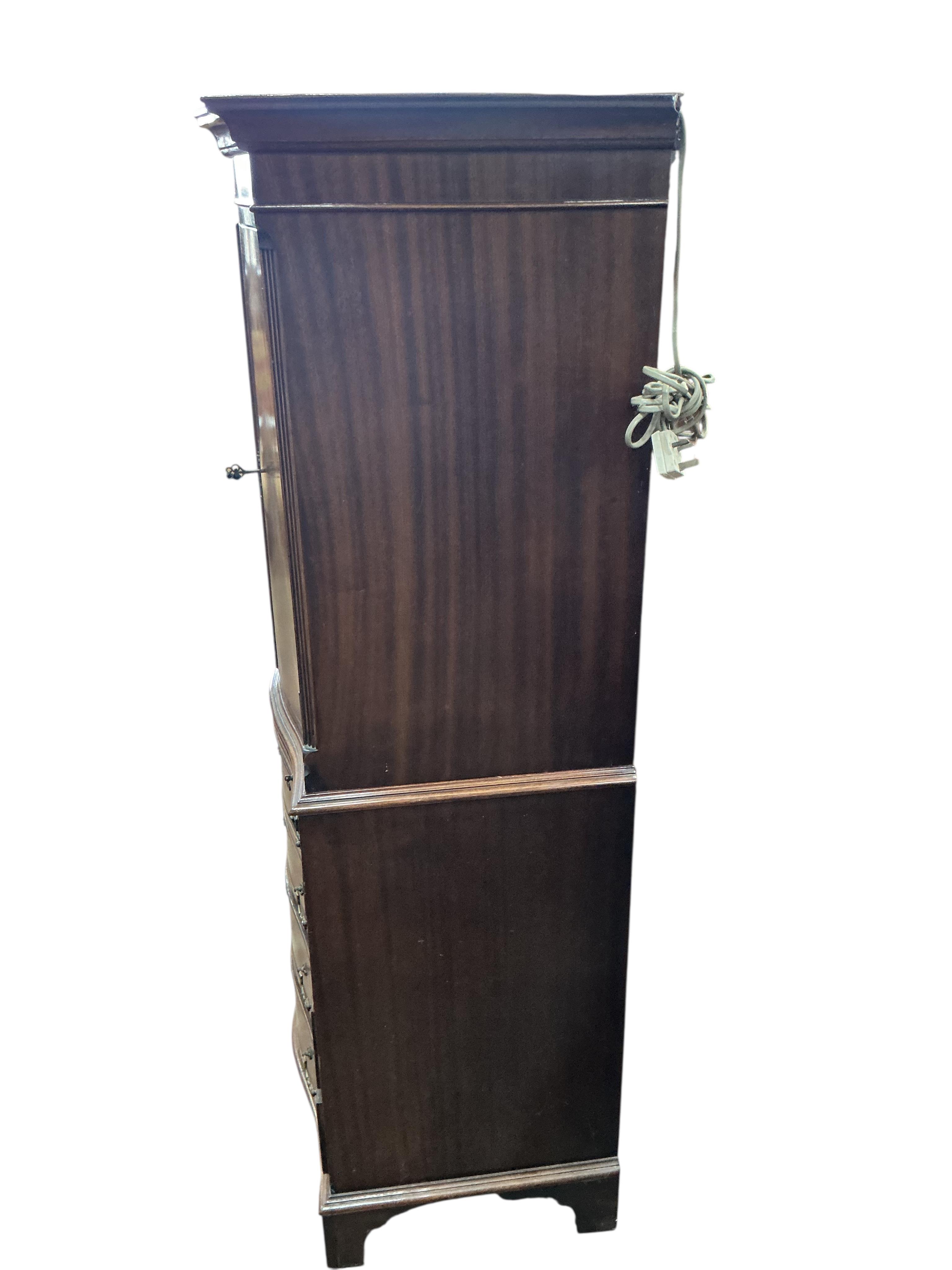 A reproduction George III style serpentine mahogany cocktail cabinet, width 71cm, depth 48cm, height 153cm